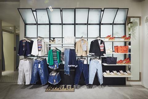 The warehouse-like feel is mimicked by the in-store window, which is framed inside black metal